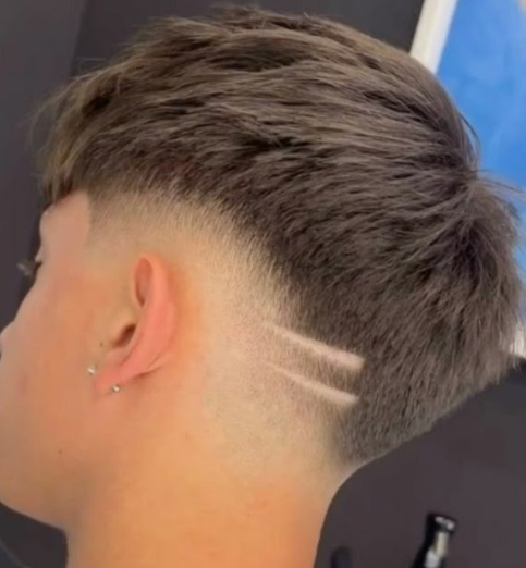 Kids fade haircut with line design at Good Hand Barber Collinswood
